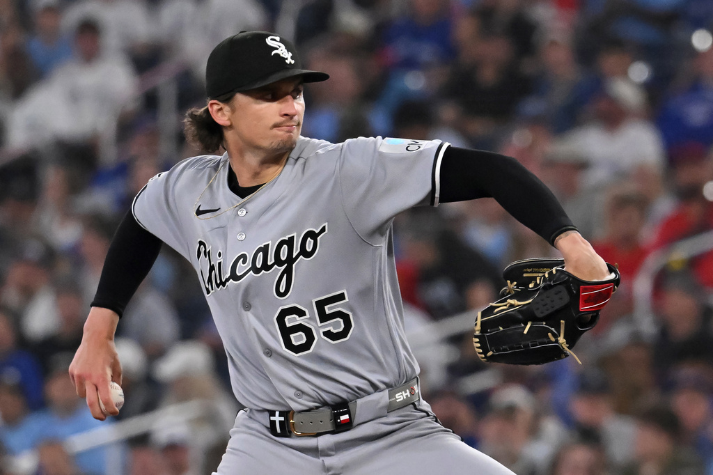 Chicago White Sox starting pitcher Davis Martin (65) throws to a Toronto Blue Jays batter during first inning of a baseball game in Toronto, Saturday, July 18, 2026. (Jon Blacker/The Canadian Press via AP)