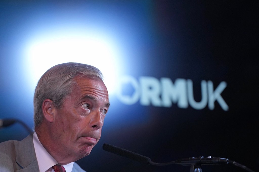 Nigel Farage, Leader of Britain's Reform UK party, speaks during a press conference in London, Monday, Aug. 10, 2026. (AP Photo/Kin Cheung)