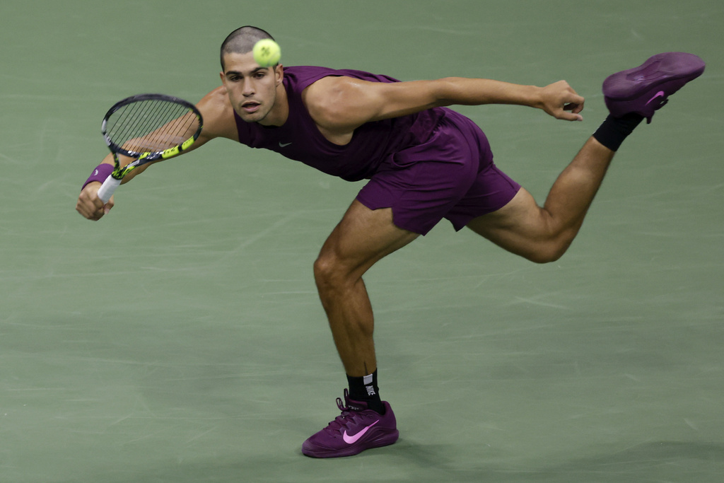 Carlos Alcaraz, of Spain returns a shot to Mattia Bellucci, of Italy, during the second round of the U.S. Open tennis championships, Wednesday, Aug. 27, 2025, in New York. (AP Photo/Adam Hunger)