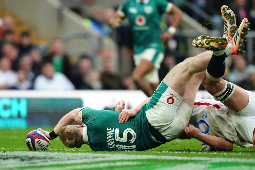 Ireland's Jamie Osborne scores a try during the Six Nations rugby union match between England and Ireland in London, England, Saturday, Feb. 21, 2026. (AP Photo/Alastair Grant)