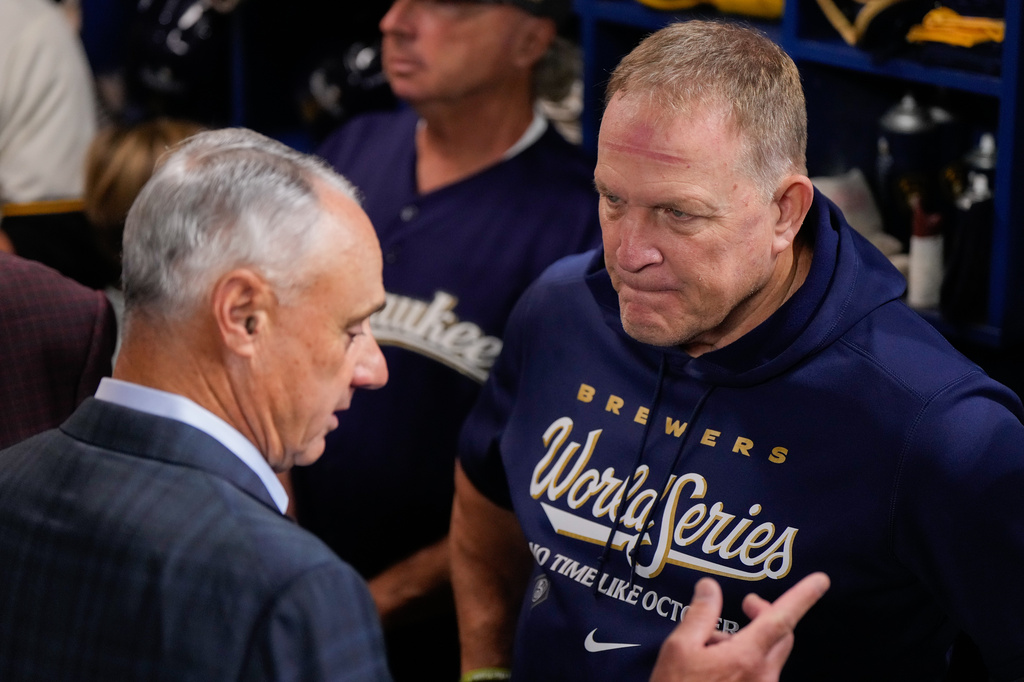 MLB Commissioner Rob Manfred, left, speaks with Milwaukee Brewers manager Pat Murphy prior to Game 1 of baseball's World Series, Friday, Oct. 23, 2026, in Milwaukee, between the Milwaukee Brewers and the Tampa Bay Rays. (AP Photo/Ashley Landis)