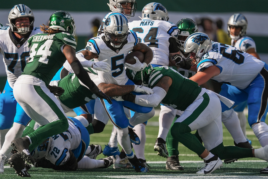 Carolina Panthers running back Rico Dowdle (5) carries the ball against the New York Jets during the second quarter of an NFL football game, Sunday, Oct. 19, 2025, in East Rutherford, N.J. (AP Photo/Seth Wenig)