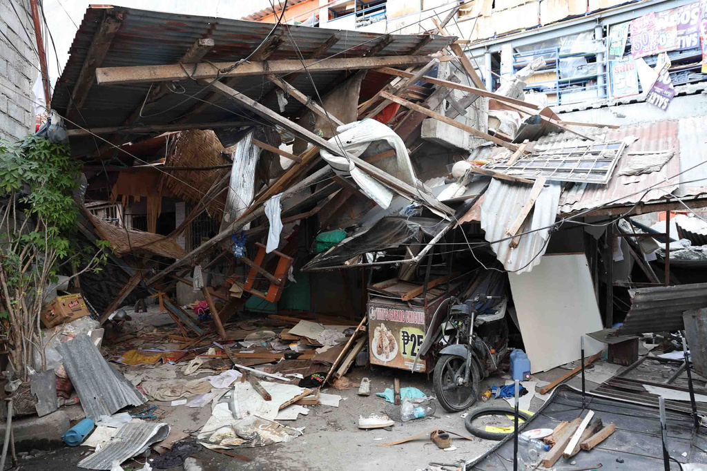 Damaged houses are seen following an earthquake in General Santos, Philippines Tuesday, June 9, 2026. (AP Photo/Basilio Sepe)