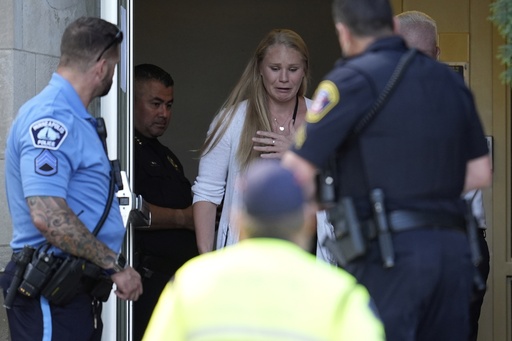 A person walks out of the Annunciation Church's school as police response to a reported mass shooting, Wednesday, Aug. 27, 2025, in Minneapolis. (AP Photo/Abbie Parr) A person walks out of the Annunciation Church's school as police response to a reported mass shooting, Wednesday, Aug. 27, 2025, in Minneapolis. (AP Photo/Abbie Parr)