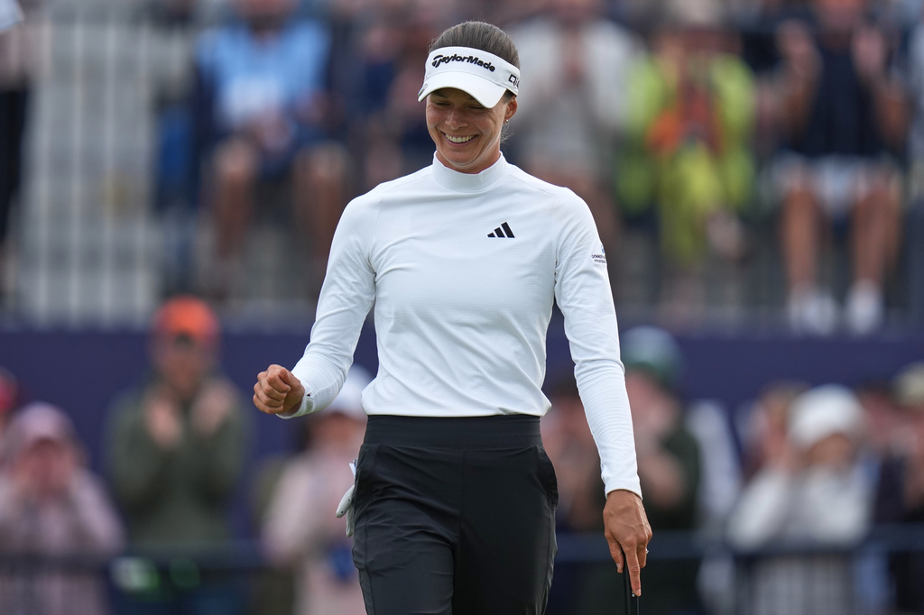 Esther Henseleit, of Germany, celebrates after putting on the 18th green during the fourth round of the Women's British Open golf championship in Lytham St Annes, England, Sunday, Aug. 2, 2026. (AP Photo/Jon Super)