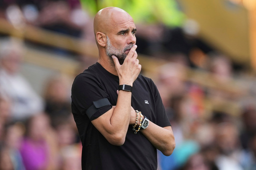 FILE - Manchester City's head coach Pep Guardiola concentrates during the English Premier League soccer match between Wolverhampton Wanderers and Manchester City at Molineux Stadium, Wolverhampton, England, on Aug. 16, 2025. (AP Photo/Dave Shopland, File) FILE - Manchester City's head coach Pep Guardiola concentrates during the English Premier League soccer match between Wolverhampton Wanderers and Manchester City at Molineux Stadium, Wolverhampton, England, on Aug. 16, 2025. (AP Photo/Dave Shopland, File)
