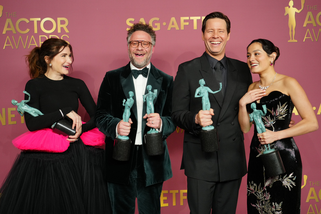 Seth Rogen, second from left, winner of the award for outstanding performance by a male actor in a comedy series for "The Studio," Kathryn Hahn, Ike Barinholtz, and Chase Sui Wonders pose in the press room with the award for outstanding performance by an ensemble in a comedy series for "The Studio" during the 32nd Annual Actor Awards on Sunday, March 1, 2026, at the Shrine Auditorium and Expo Hall in Los Angeles. (Photo by Jordan Strauss/Invision/AP)