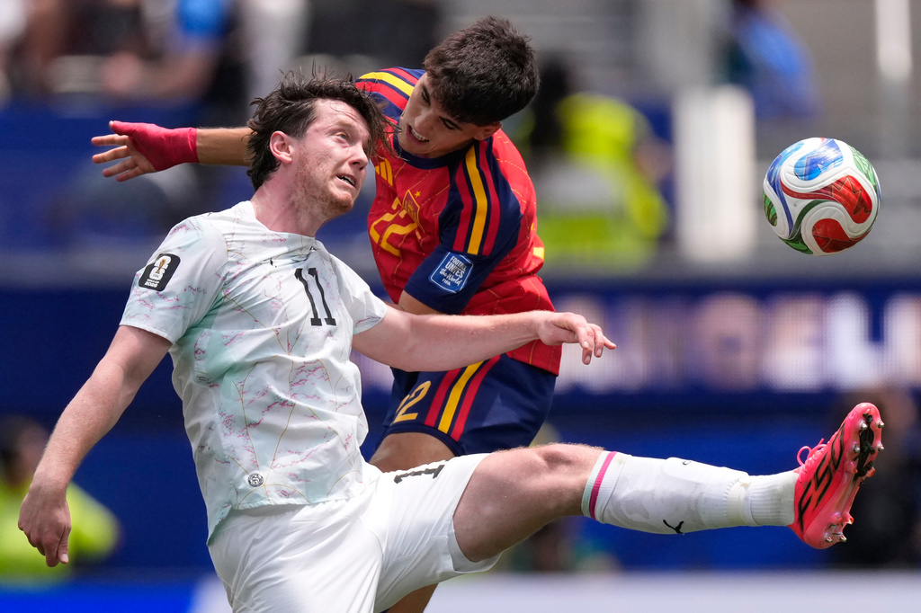 Austria's Michael Gregoritsch (11) and Spain's Pau Cubarsi go for a header during the World Cup round of 32 soccer match in Inglewood, Calif., near Los Angeles, Thursday, July 2, 2026. (AP Photo/Mark J. Terrill)
