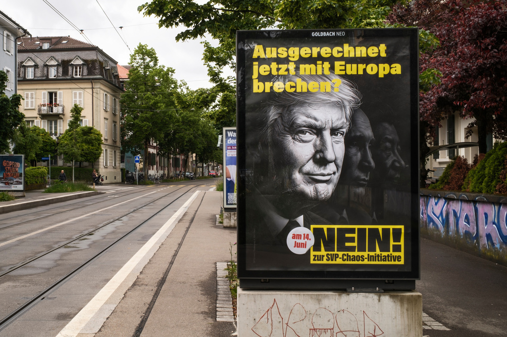 A poster reading "To break away from Europe at a time like this - No to the SVP Chaos Initiative", featuring images of President Donald Trump, Russian President Vladimir Putin and Chinese President Xi Jinping, urging people to vote against the Swiss People's Party (SVP) referendum titled "No to a Switzerland with 10 million inhabitants" photographed in Bern, May 18, 2026. (Christian Beutler/Keystone via AP)