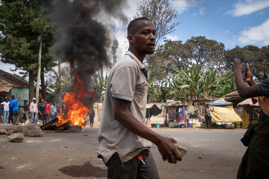 People protest in the streets of Arusha, Tanzania, on election day Wednesday, Oct. 29, 2025. (AP Photo/str)