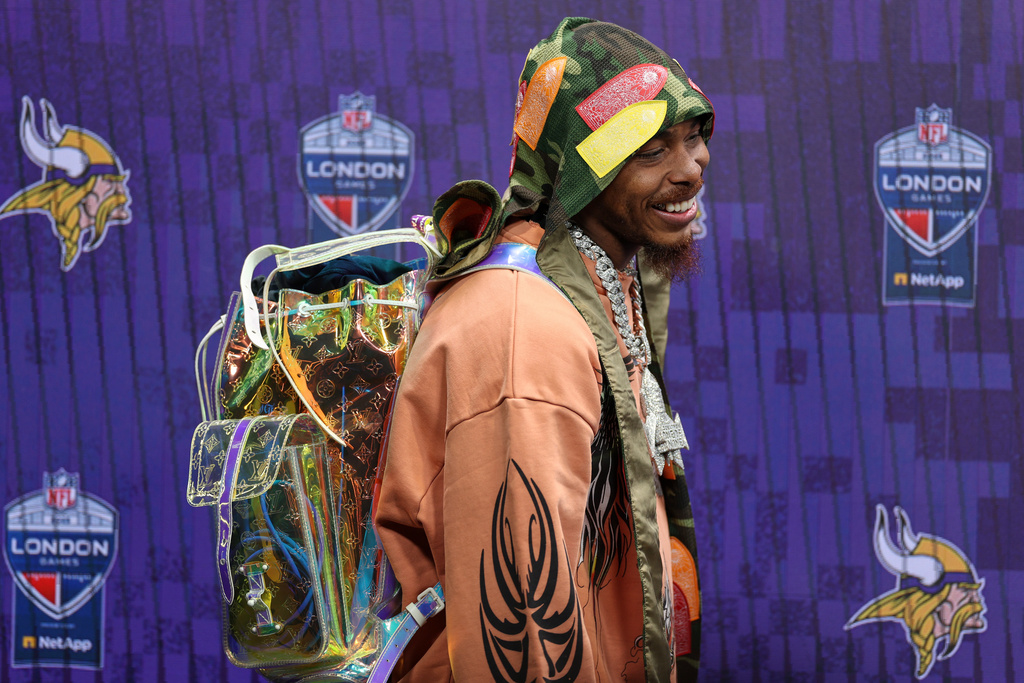 Minnesota Vikings wide receiver Justin Jefferson (18) arrives for a press conference after the NFL game between Minnesota Vikings and Cleveland Browns at the Tottenham Hotspur stadium in London, Sunday, Oct. 5, 2025. (AP Photo/Ian Walton)