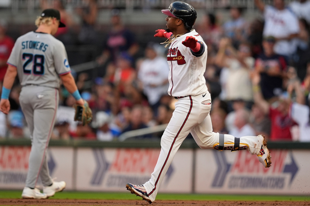 Atlanta Braves' Ozzie Albies (1) celebrates his solo homerun in the second inning of a baseball game against the Miami Marlins, Tuesday, Aug. 4, 2026, in Atlanta. (AP Photo/Mike Stewart)