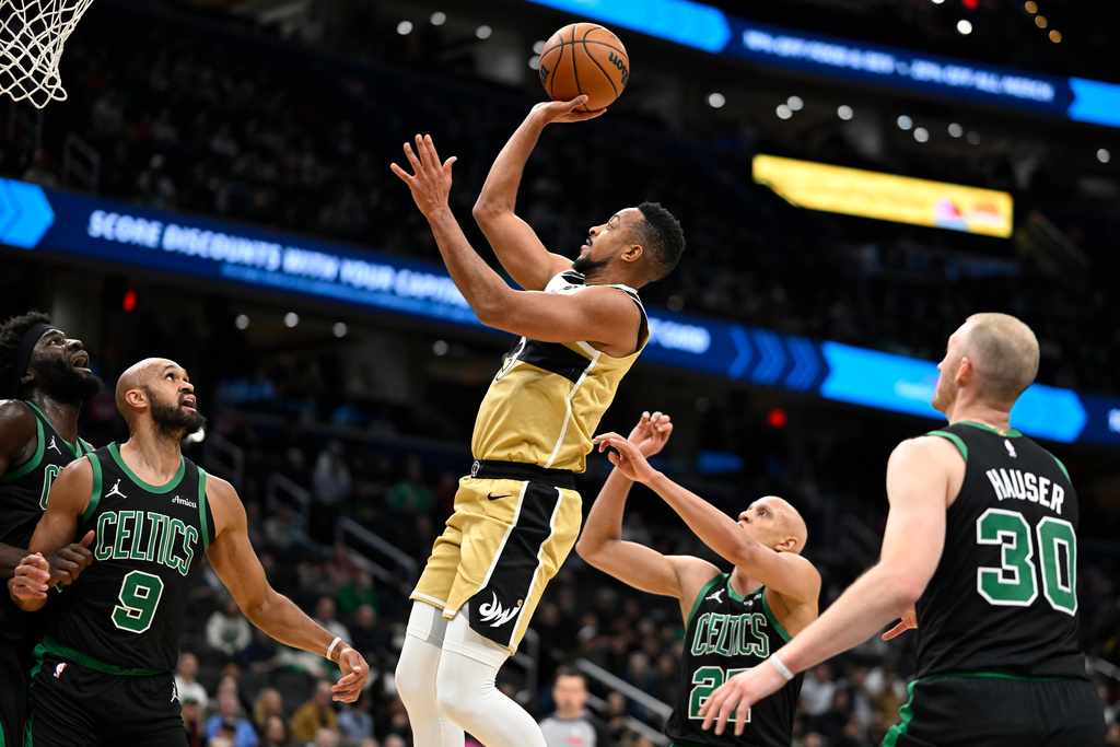 Washington Wizards guard CJ McCollum goes up to score during the first half of an NBA basketball game against the Boston Celtics, Thursday, Dec. 4, 2025, in Washington. (AP Photo/John McDonnell)