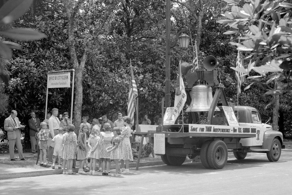 In this 1950s photo provided by the State Archives of North Carolina, people stand around a flatbed truck with a replica of the Liberty Bell mounted to it during a savings bond drive in North Carolina. (Pryor Emerson Humphrey Photograph Collection/State Archives of North Carolina via AP)