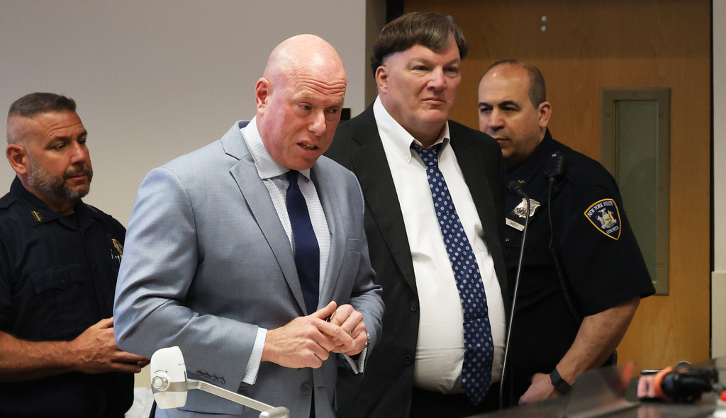Attorney Michael Brown speaks with the judge as Rex A. Heuermann, pleads guilty to murdering seven women and admitted he killed an eighth in a string of long-unsolved crimes known as the Gilgo Beach killings, at a court hearing in Suffolk County Court in Riverhead, N.Y., Wednesday, April 8, 2026. (James Carbone/Newsday via AP, Pool)