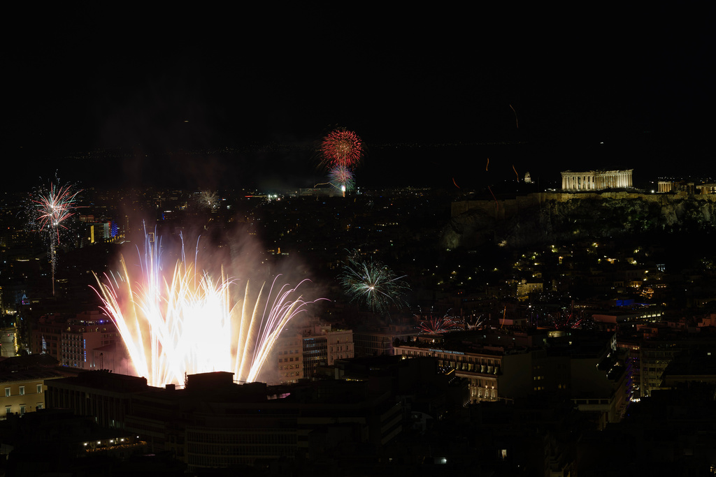 Fireworks burst over the Greek capital during the New Year's Eve celebrations, in Athens, Greece, early Thursday, Jan. 1, 2026. (AP Photo/Yorgos Karahalis)