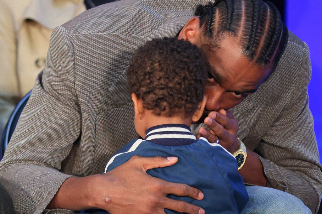 Oklahoma City Thunder guard Shai Gilgeous-Alexander whispers to his son Ares Alexander before a news conference after Gilgeous-Alexander was named the NBA basketball MVP, Sunday, May 17, 2026, in Oklahoma City. (AP Photo/Nate Billings)