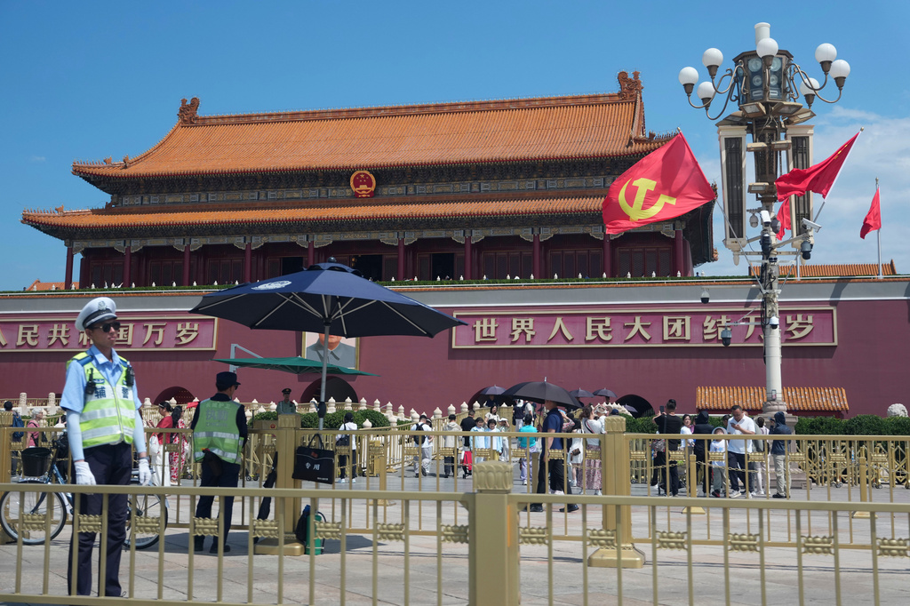 Flags bearing the hammer and sickle symbol are flown in front of Tiananmen Gate in Beijing, China, Thursday, June 4, 2026. (AP Photo/Ng Han Guan)