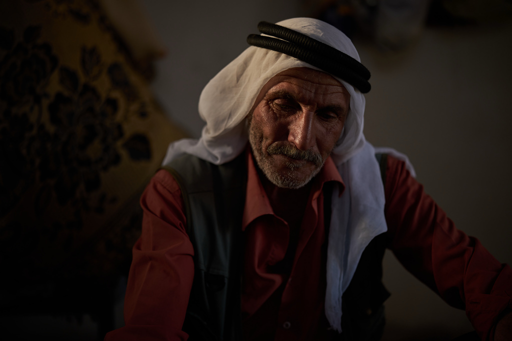 Jibrin Abu Aram, 62, looks down as he talks about settlers attacks in his community near the West Bank village of Susya, in the Masafer Yatta region, Wednesday, June 17, 2026. "We are living like prisoners inside our homes”, says the 62-year-old Palestinian. (AP Photo/Leo Correa)