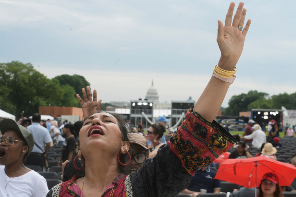 Guest attend the Rededicate 250: A National Jubilee Of Prayer, Praise & Thanksgiving, Sunday, May 17, 2026, in Washington. (AP Photo/Rod Lamkey, Jr.)