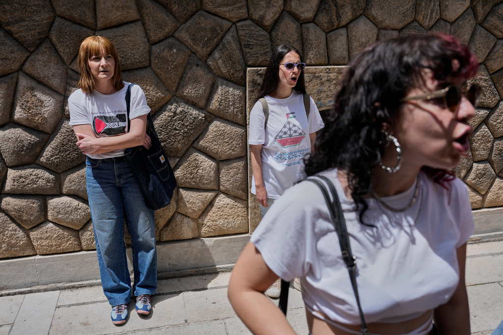 Protesters chant pro-Palestinian slogans outside Greece's Foreign Ministry after Israel's navy intercepted an activist flotilla in waters off of Cyprus, in Athens, Tuesday, May 19, 2026. (AP Photo/Thanassis Stavrakis)