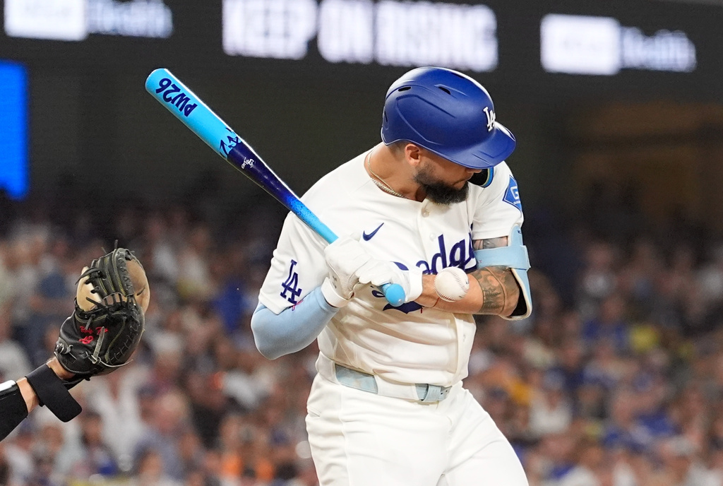 Los Angeles Dodgers' Andy Pages is hit in the hand by a pitch during the third inning of a baseball game against the Pittsburgh Pirates, Friday, Aug. 21, 2026, in Los Angeles. (AP Photo/Mark J. Terrill)