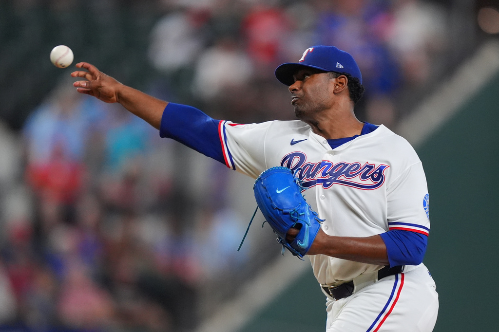 Texas Rangers starting pitcher Kumar Rocker throws during the first inning of a baseball game against the against the Chicago White Sox, Tuesday, July 21, 2026, in Arlington, Texas. (AP Photo/LM Otero)