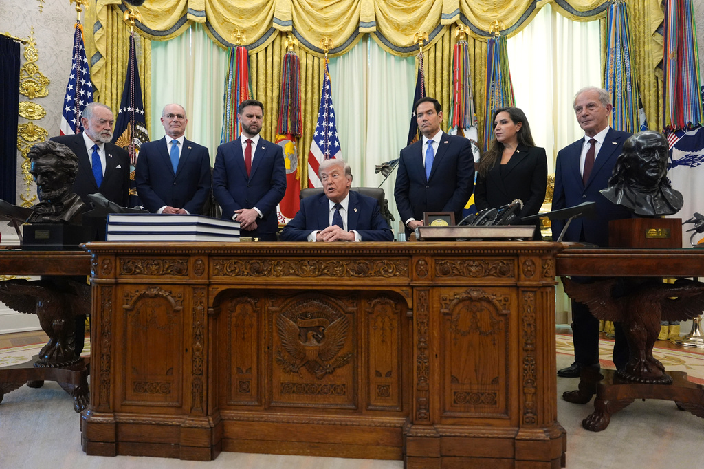 CORRECTS TO MICHEL ISSA NOT STEVE WITKOFF From left, U.S. Ambassador to Israel Mike Huckabee, Israeli Ambassador to the U.S. Yechiel Leiter, Vice President JD Vance, Secretary of State Marco Rubio, Lebanese Ambassador to the U.S. Nada Hamadeh Moawad, and U.S. Ambassador to Lebanon Michel Issa, listen to President Donald Trump speak in the Oval Office at the White House, Thursday, April 23, 2026, in Washington. (AP Photo/Mark Schiefelbein)