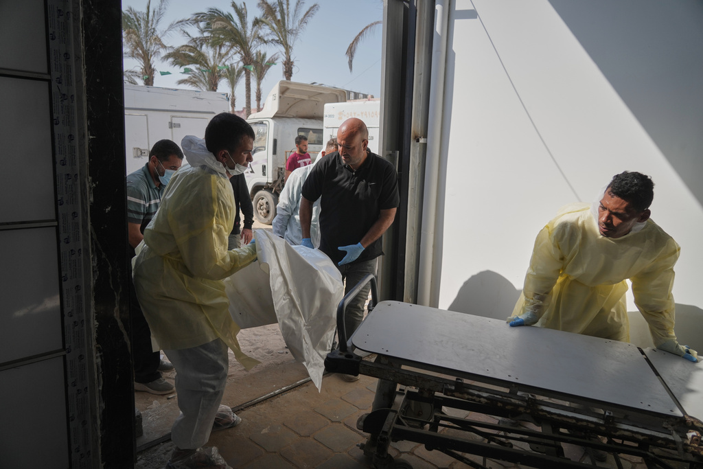 Bodies of unidentified Palestinians returned from Israel as part of the ceasefire deal are brought to Nasser Hospital in Khan Younis, Gaza Strip, Wednesday Nov. 5, 2025. (AP Photo/Jehad Alshrafi)