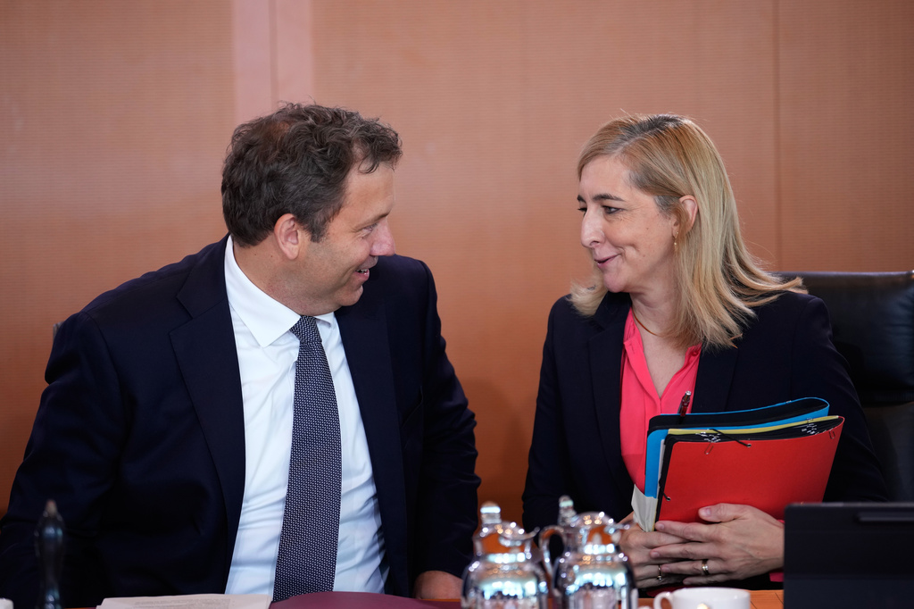 German Finance Minister and Vice Chancellor Lars Klingbeil, left, speaks to Chief of Staff at the Chancellery Nina Warken prior to the cabinet meeting at the chancellery in Berlin, Germany, Wednesday, Aug. 12, 2026. (AP Photo/Ebrahim Noroozi)