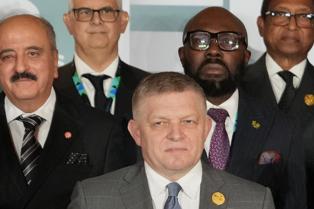 In this Monday, Nov. 24, 2025 photo, Slovakia's Prime Minister Robert Fico, center, poses for a group photo during of the African Union-European Union summit in Luanda, Angola. (AP Photo/Thibault Camus)