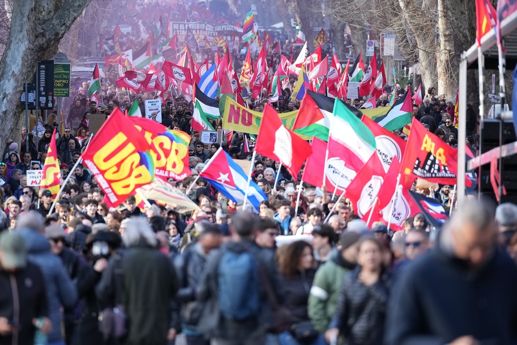 People take part in a national demonstration against the war in Iran and the March 22 referendum on the Italian justice system, in Rome, Saturday, March 14 2026. (AP Photo/Andrew Medichini)