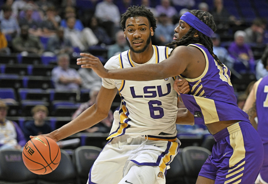 LSU forward Robert Miller III (6) drives the ball around Alcorn State forward Omari Hamilton (12), Tuesday, Nov. 18, 2025, at the LSU PMAC in Baton Rouge, La. (Hilary Scheinuk/The Advocate via AP)