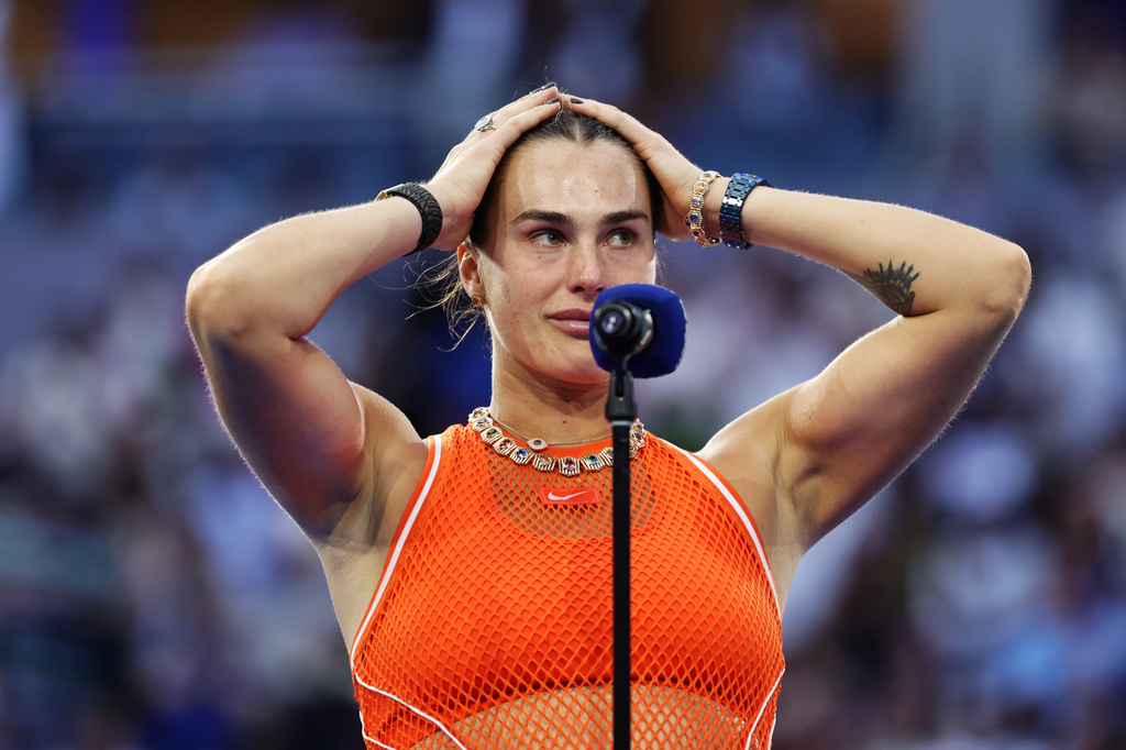 Aryna Sabalenka, of Belarus, reacts as she speaks following her lose to Elena Rybakina, of Kazakhstan, in the women's singles final of the U.S. Open tennis championships Saturday, Sept. 12, 2026, in New York. (AP Photo/Adam Hunger)