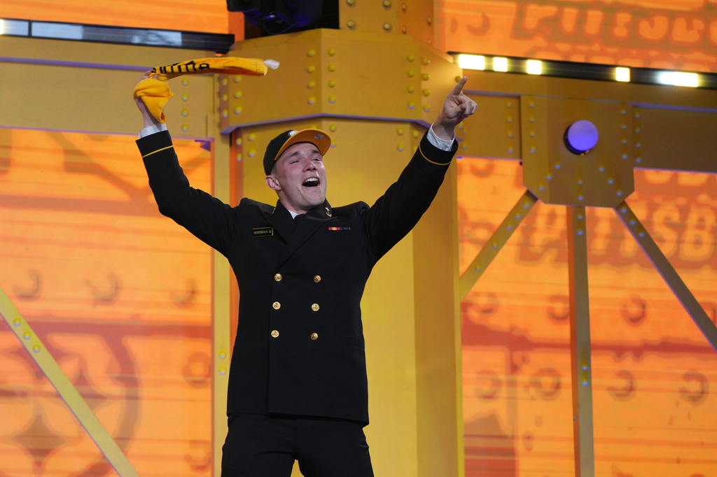 Navy running back Eli Heidenreich celebrates after being chosen by the Pittsburgh Steelers with the 230th overall pick during third day of the NFL football draft, Saturday, April 25, 2026, in Pittsburgh. (AP Photo/Gene J. Puskar)