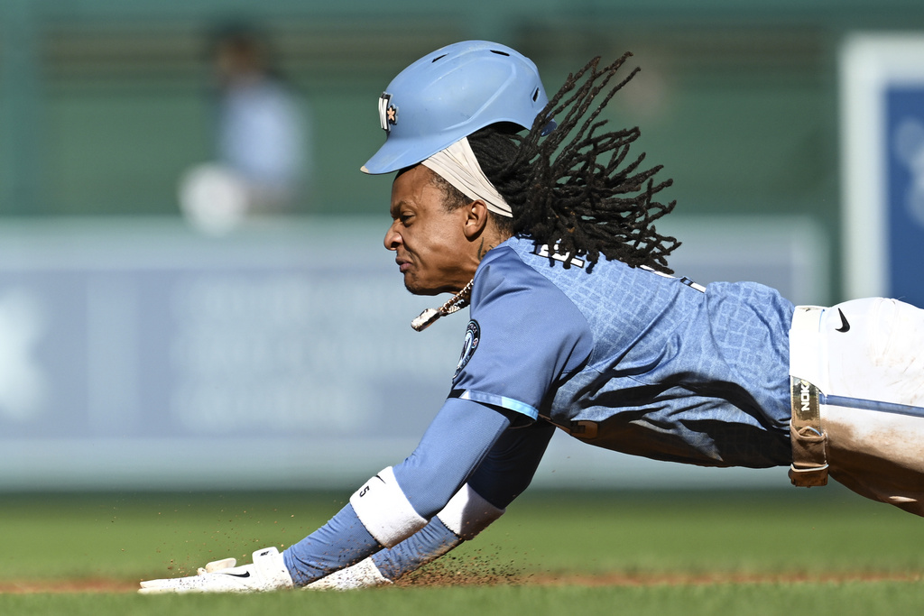 Washington Nationals' CJ Abrams slides into second base for a stolen base during the third inning of a baseball game against the Tampa Bay Rays, Saturday, Aug. 30, 2025, in Washington. (AP Photo/Terrance Williams)