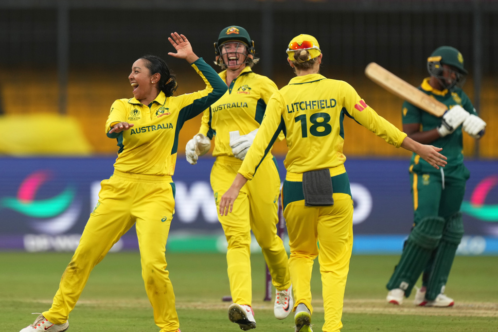 Australia's Alana King, left, celebrates with teammate the wicket of South Africa's Sinola Jafta during the ICC Women's Cricket World Cup match between Australia and South Africa in Indore, India, Saturday, Oct. 25, 2025. (AP Photo/Ajit Solanki)