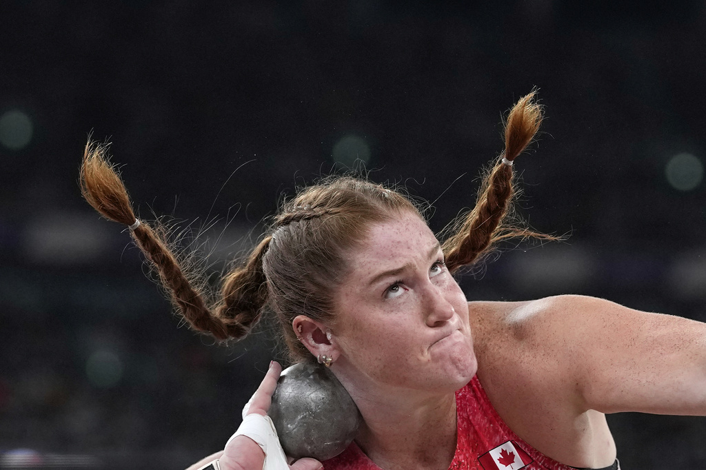 Canada's Sarah Mitton makes an attempt in the women's shot put final at the World Athletics Championships in Tokyo, Saturday, Sept. 20, 2025. (AP Photo/Matthias Schrader)