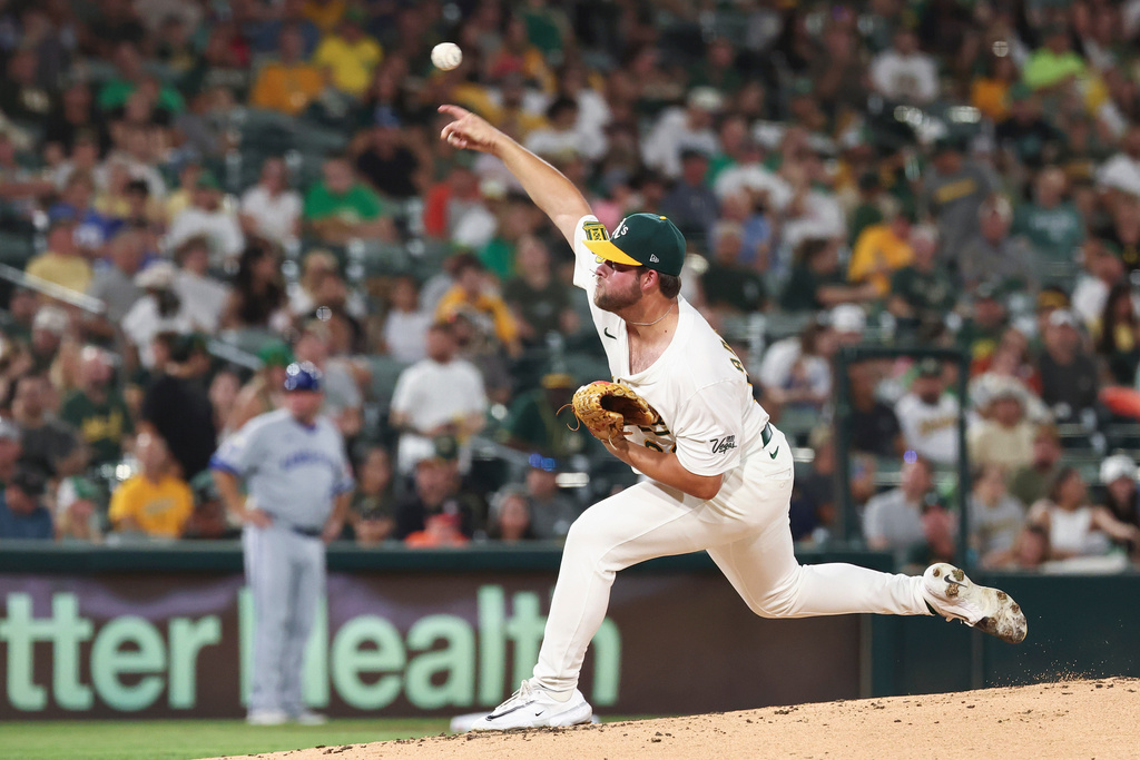 Athletics pitcher Mason Barnett throws to the Kansas City Royals during the second inning of a baseball game Friday, Sept. 26, 2025, in West Sacramento, Calif. (AP Photo/Sara Nevis)