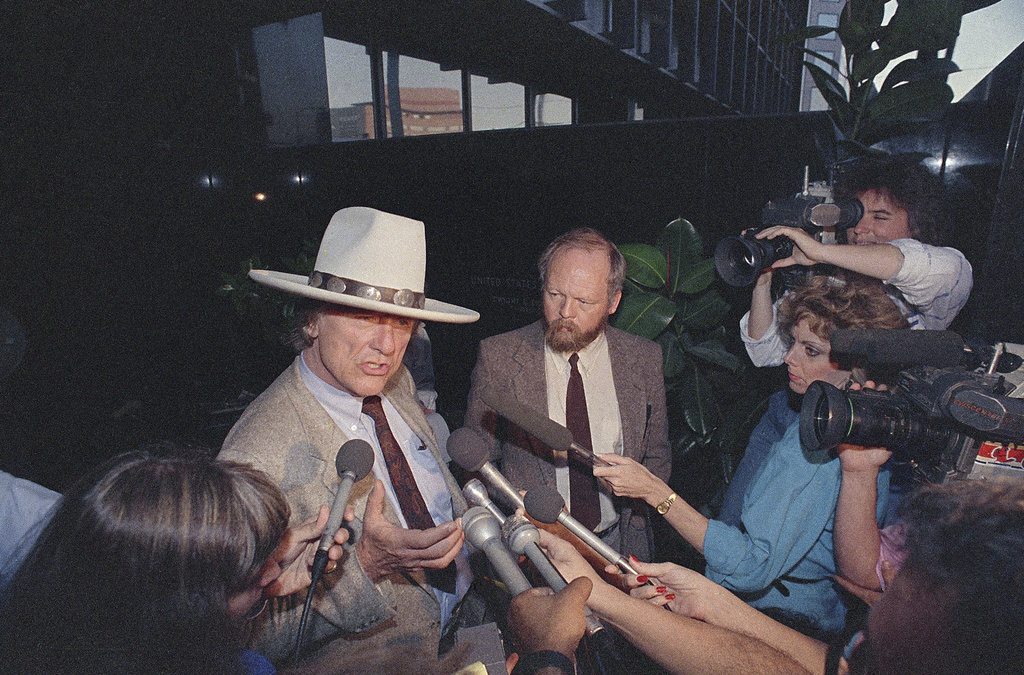 FILE - Attorney Gerry Spence, left, and activist David Foreman talk to reporters after a U.S. District Court Magistrate turned down Spence's request to identify an undercover agent whose report charges that four environmentalists conspired to sabotage nuclear facilities in three southwestern states, in Phoenix, June 6, 1989. (AP Photo/Chad Surmick, File)