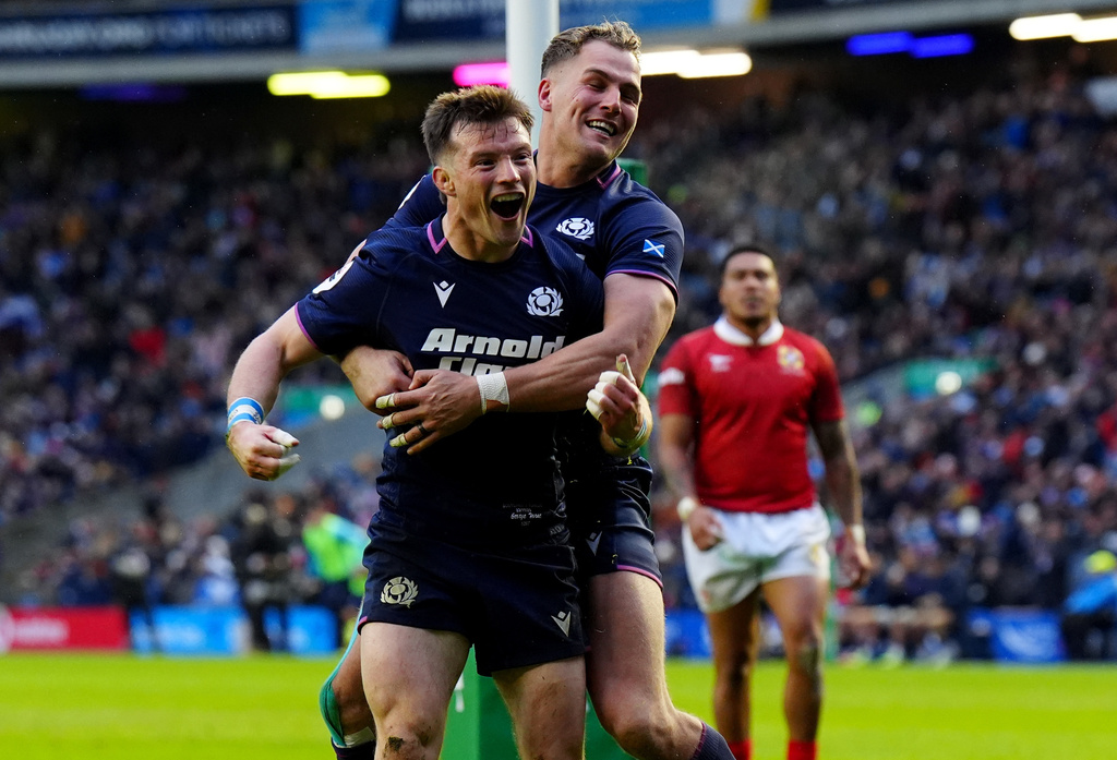 Scotland's George Horne, left, celebrates after scoring his sides seventh try with his teammate Duhan van der Merwe during the Quilter Nations Series Rugby match between Scotland and Tonga in Edinburgh, Scotland, Sunday, Nov. 23, 2025. (Jane Barlow/PA via AP)