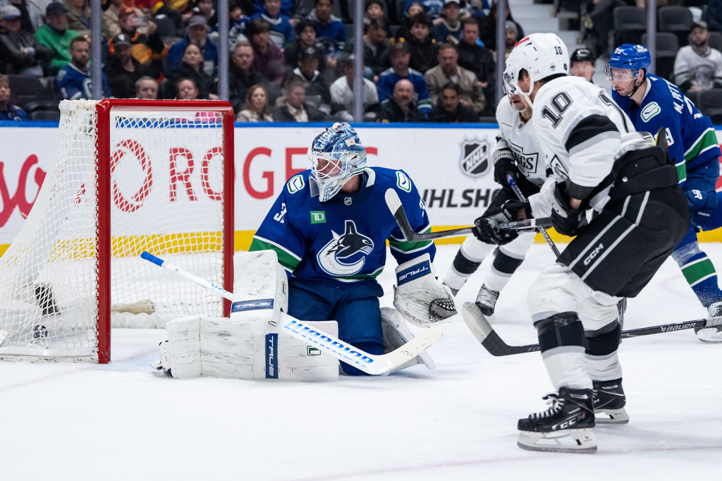 Los Angeles Kings' Artemi Panarin (10) scores on Vancouver Canucks goaltender Kevin Lankinen (32) during the second period of an NHL hockey game in Vancouver, on Thursday, March 26, 2026. (Ethan Cairns/The Canadian Press via AP)