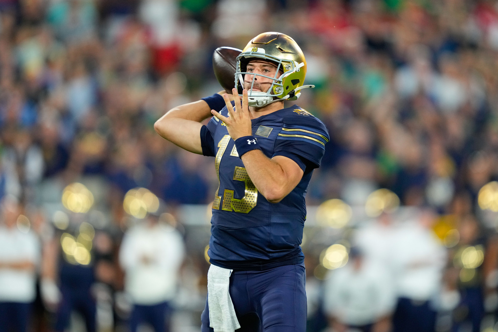 Notre Dame quarterback CJ Carr throws during the first half of an NCAA college football game against Wisconsin Sunday, Sept. 6, 2026, in Green Bay, Wis. (AP Photo/Kayla Wolf)