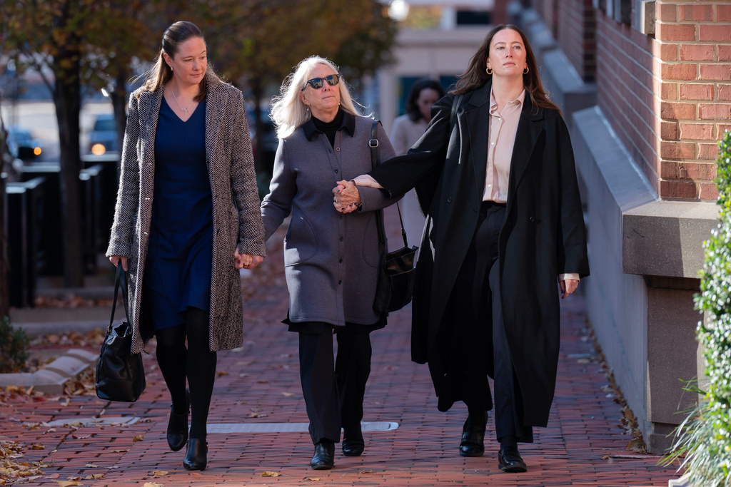 Patrice Failor, wife of former FBI Director James Comey, center, Claire Comey, right, and Maurene Comey, left, both daughters of former FBI Director James Comey, arrive at federal courthouse in Alexandria, Va., Thursday, Nov. 13, 2025. (AP Photo/Jose Luis Magana)