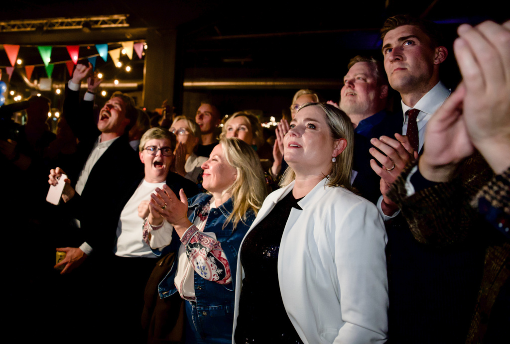 Leaders of the No campaign react as early results from rural Iceland put the No side ahead during an election-night gathering in Reykjavik, Iceland, Saturday, Aug. 29, 2026. (AP Photo/Marco Di Marco)