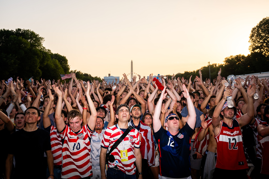 People cheer at a watch party for a World Cup soccer match between the United States and Bosnia Wednesday, July 1, 2026, in Washington, at the FIFA Fan Zone on the National Mall. (AP Photo/Allison Robbert)