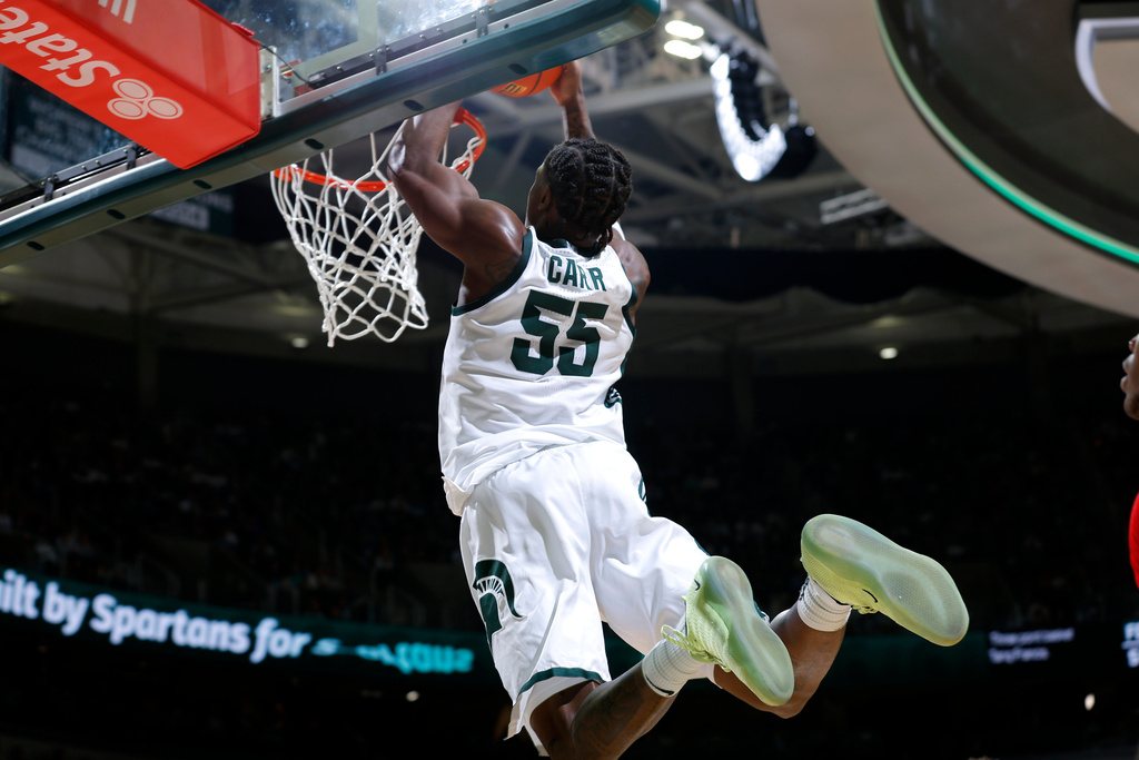 Michigan State forward Coen Carr (55) dunks during the second half of an NCAA college basketball game against Rutgers, Thursday, March 5, 2026, in East Lansing, Mich. (AP Photo/Al Goldis)