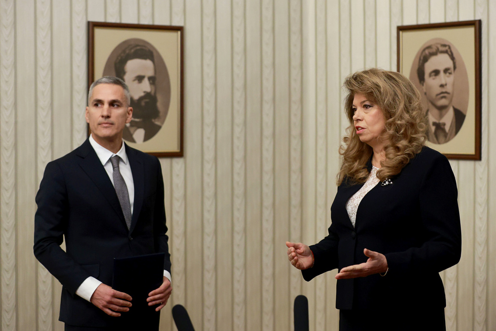 Bulgarian President Iliana Yotova, right, appoints Andrey Gyurov to lead as Prime Minister a caretaker government whose main task will be to organise free and fair elections in a country that will hold elections for the eighth time in the last five years, Sofia, Bulgaria, Thursday, Feb. 12, 2026. (Bulgarian News Agency via AP)
