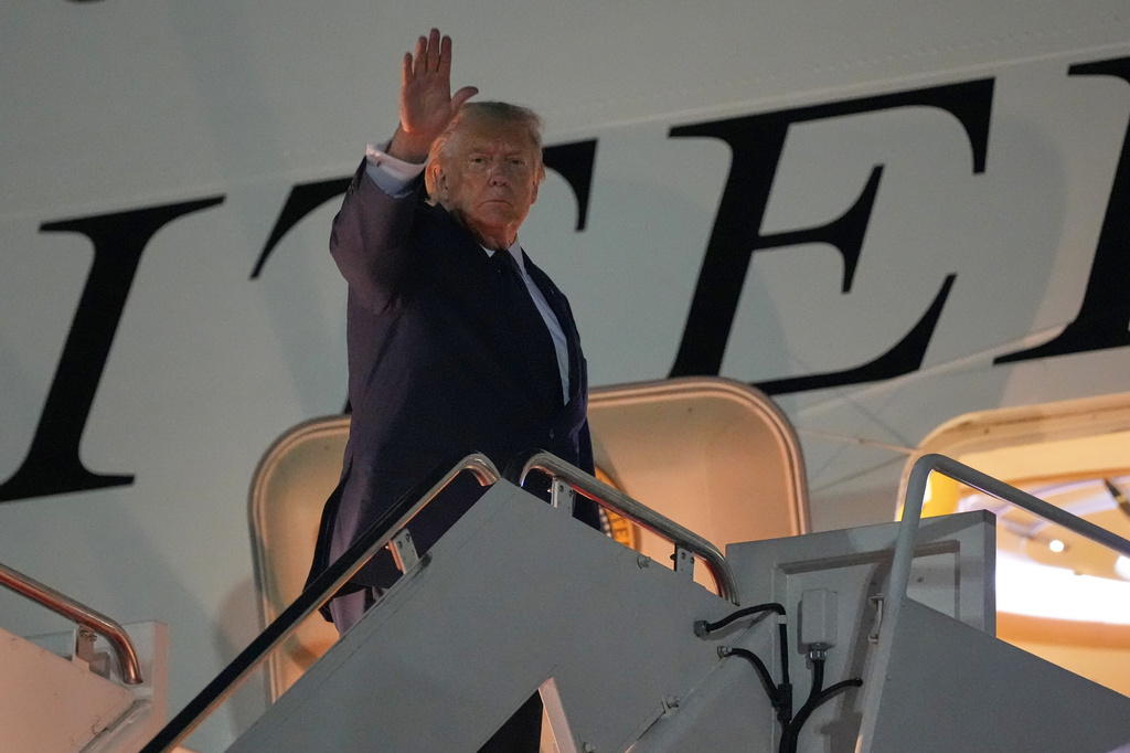 President Donald Trump waves as he boards Air Force One, Monday, July 6, 2026, at Joint Base Andrews, Md. (AP Photo/Alex Brandon)