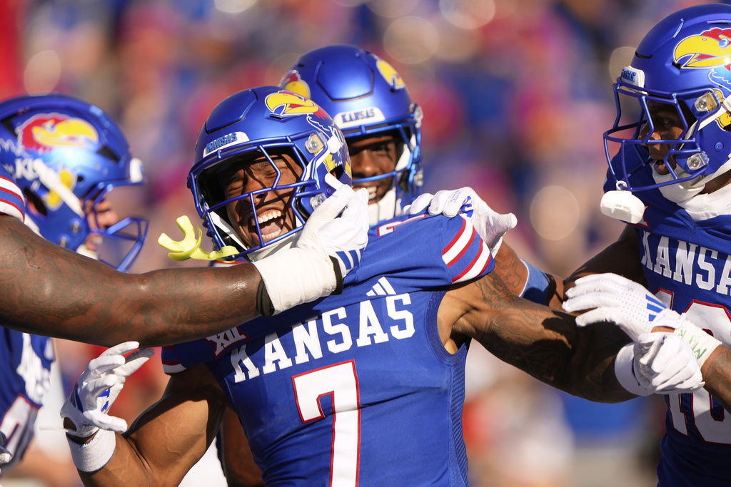 Kansas wide receiver Cam Pickett (7) celebrates after scoring a touchdown during the first half of an NCAA college football game against Fresno State, Saturday, Aug. 23, 2025, in Lawrence, Kan. (AP Photo/Charlie Riedel)